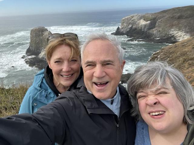 Selfie of Lisa Marie, Mark and his daughter Ciara on a rocky Oregon coast headland